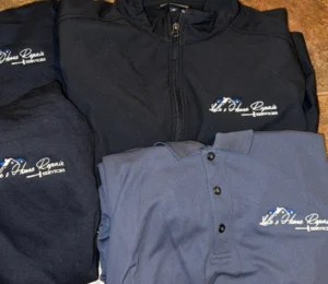Custom embroidered workwear for Lule’s Home Repair including jackets, polos, and hoodies.
