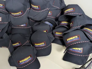 Premium UV-coated leatherette patch hats for Stewart’s Crane & Rigging.